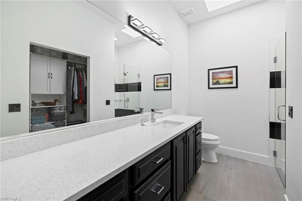 Bathroom, Dual Sink Vanities, Glass Shower, Interior, Wood Texture Flooring