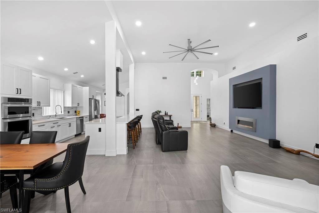 Dining room, Interior, Kitchen, Living room, Pendant Lights, Recessed Lighting, Stainless Steel Appliances, Wood Texture Flooring