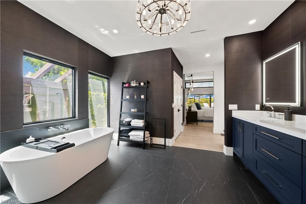 Bathroom, Chandelier, Dual Sink Vanities, Free Standing Baths, Interior, Marble, Pendant Lights, Recessed Lighting, Wood Texture Flooring