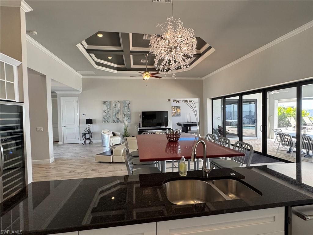 Chandelier, Dining room, Interior, Kitchen, Living room, Recessed Lighting, Wood Texture Flooring