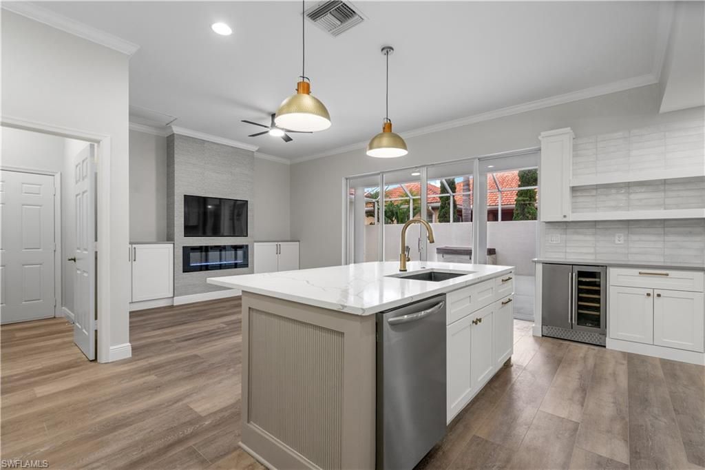 Fireplace, Interior, Kitchen, Pendant Lights, Recessed Lighting, Stainless Steel Appliances, Wood Texture Flooring