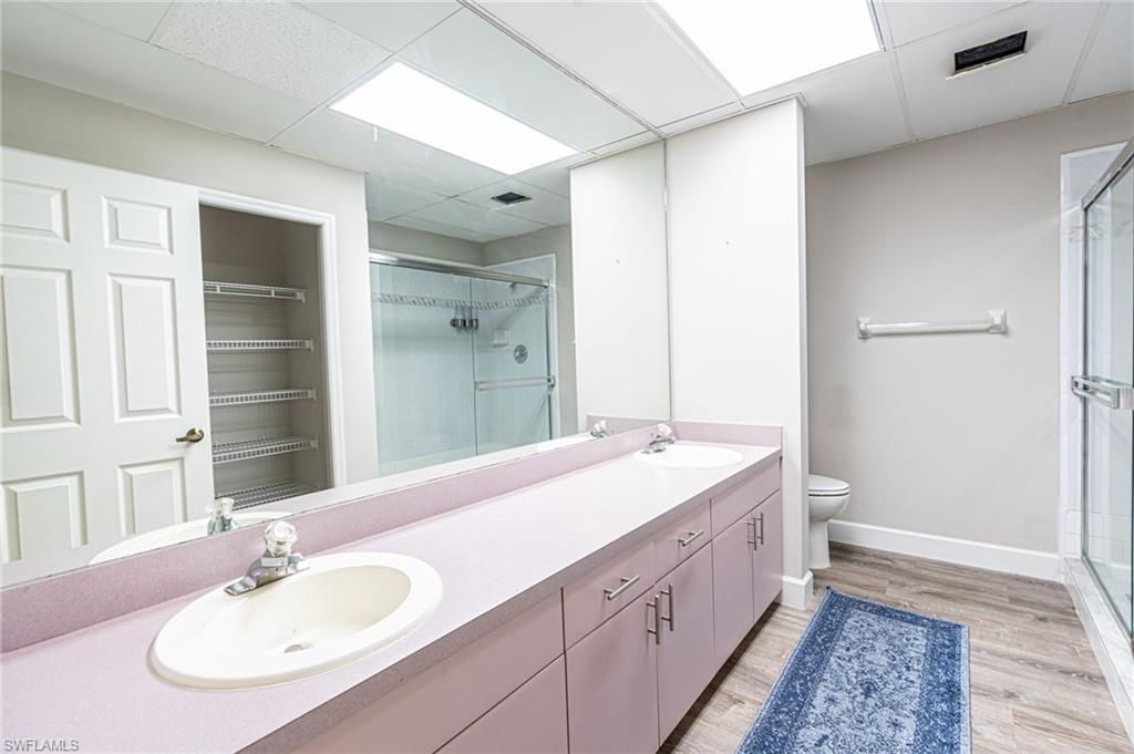 Bathroom, Dual Sink Vanities, Glass Shower, Interior, Wood Texture Flooring