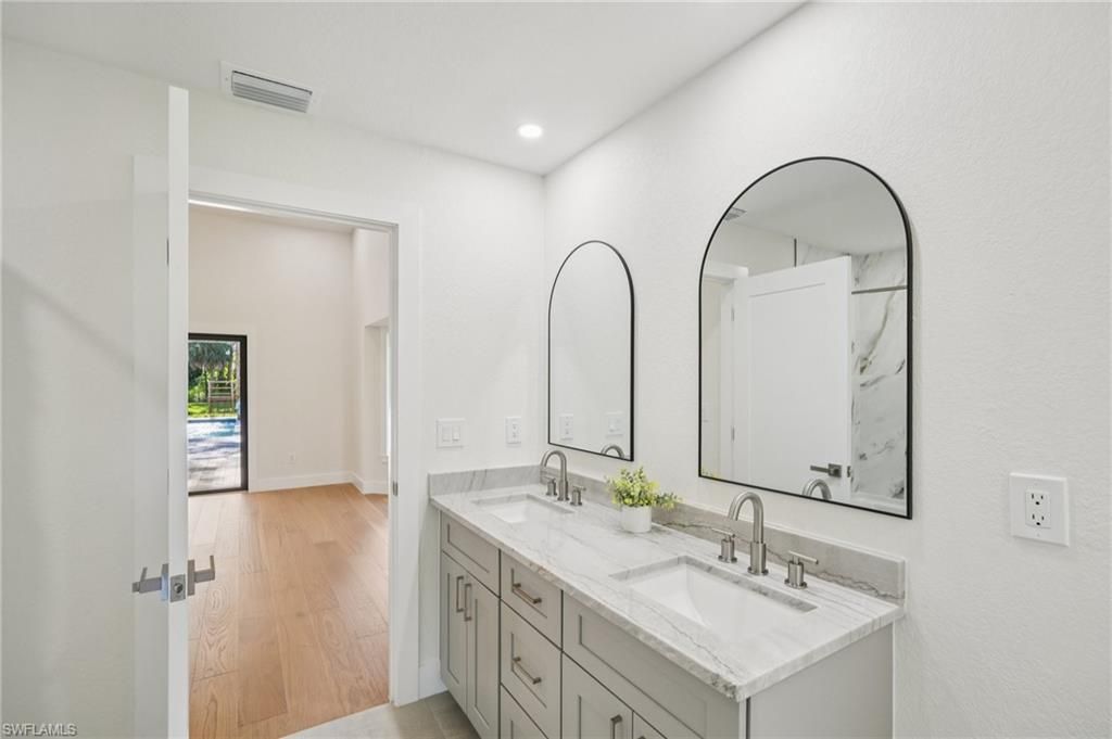 Bathroom, Dual Sink Vanities, Interior, Recessed Lighting, Wood Texture Flooring
