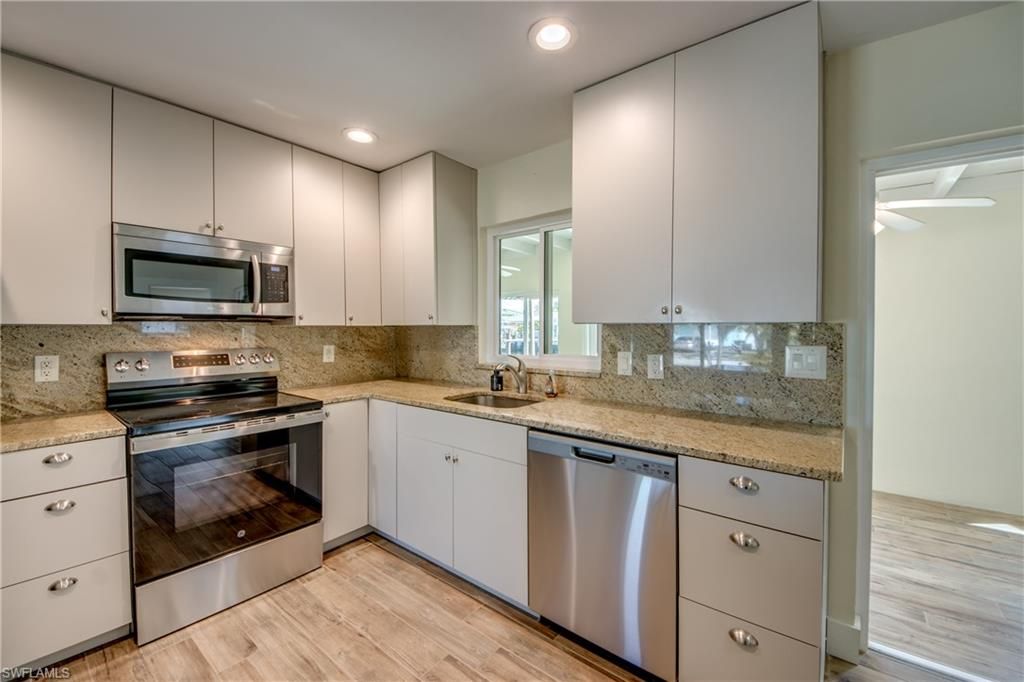 Interior, Kitchen, Recessed Lighting, Stainless Steel Appliances, Wood Texture Flooring