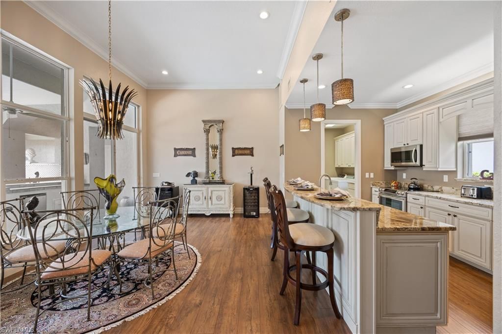 Dining room, Interior, Kitchen, Pendant Lights, Recessed Lighting, Stainless Steel Appliances, Wood Texture Flooring