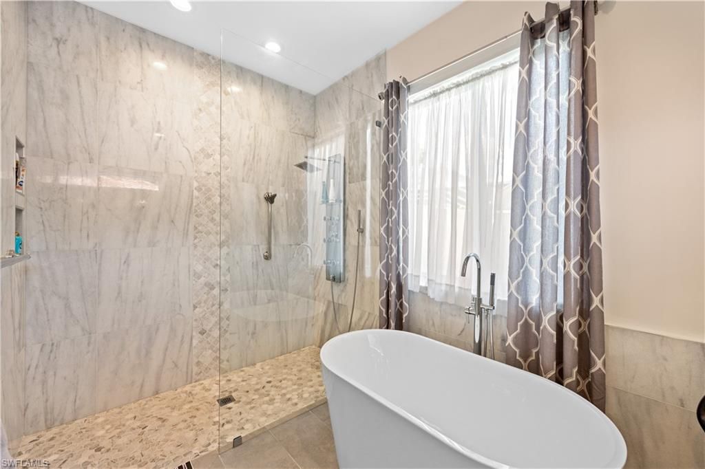 Bathroom, Free Standing Baths, Glass Shower, Interior, Marble Walls, Recessed Lighting