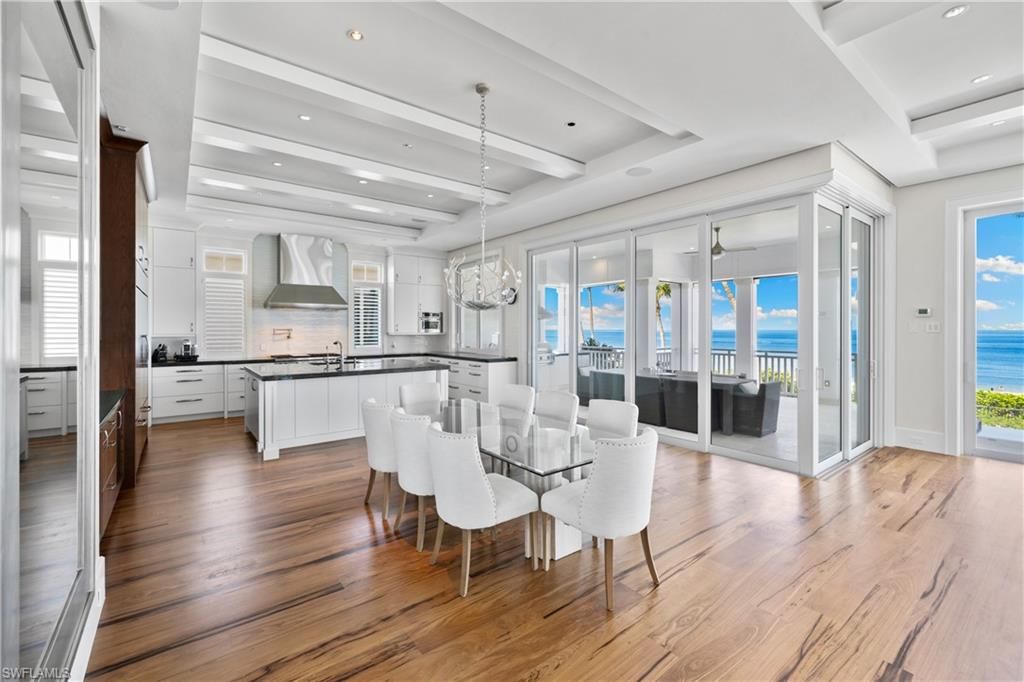 Chandelier, Dining room, Interior, Kitchen, Pendant Lights, Recessed Lighting, Stainless Steel Appliances, Water, Wood Texture Flooring