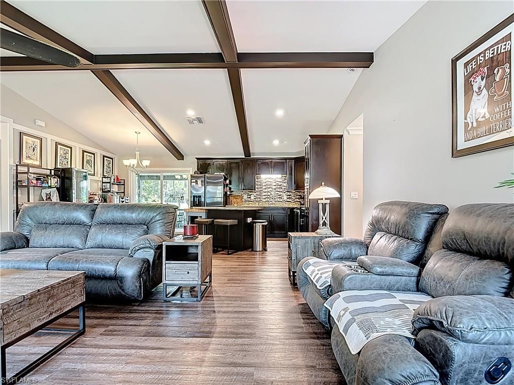 Chandelier, Interior, Kitchen, Living room, Recessed Lighting, Stainless Steel Appliances, Wooden Beams, Wood Texture Flooring