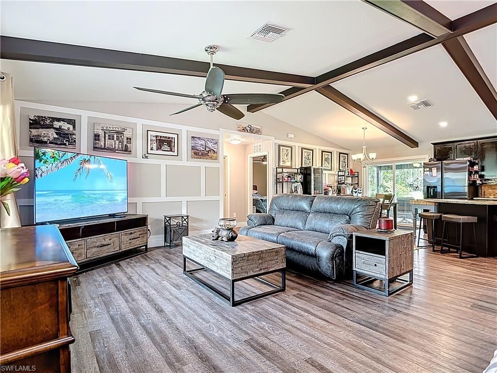 Chandelier, Interior, Kitchen, Living room, Pendant Lights, Recessed Lighting, Stainless Steel Appliances, Wooden Beams, Wood Texture Flooring