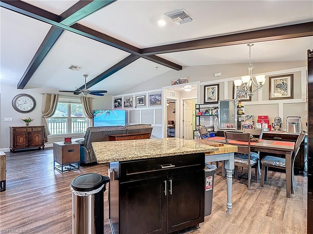 Chandelier, Dining room, Interior, Recessed Lighting, Wooden Beams, Wood Texture Flooring