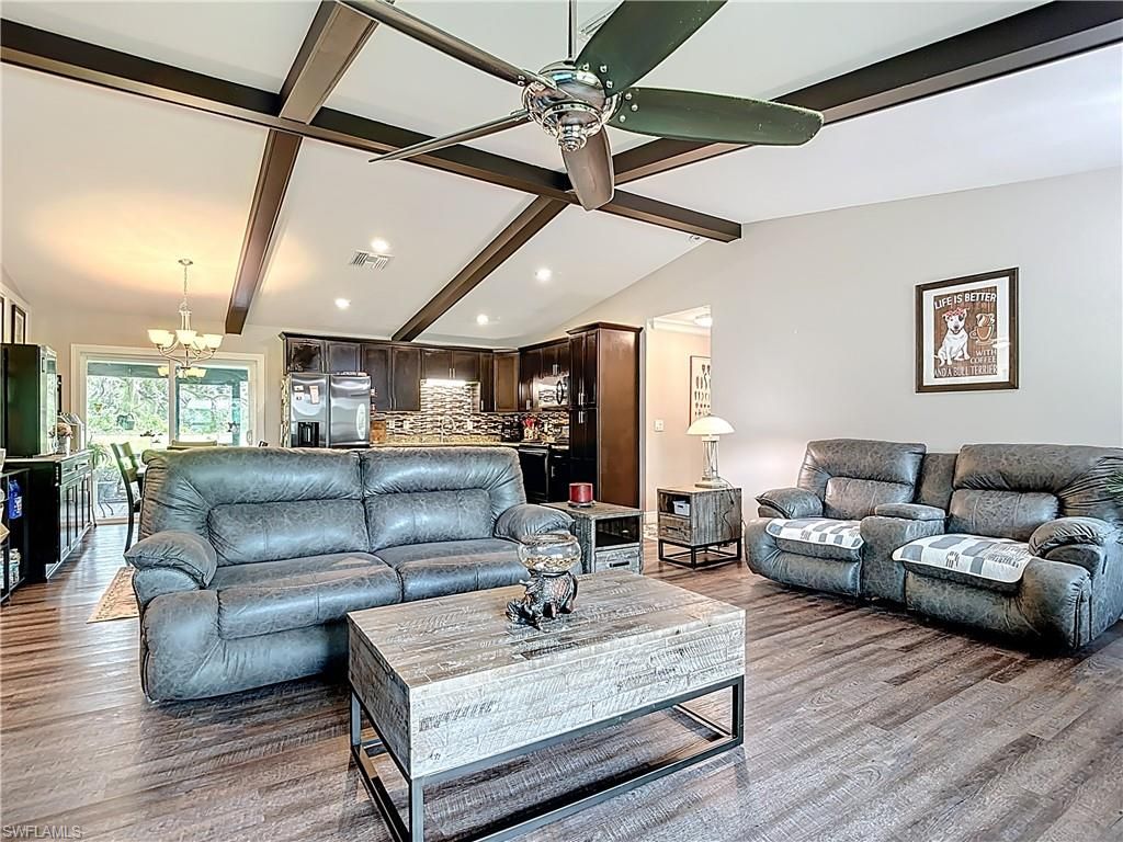 Chandelier, Dining room, Interior, Kitchen, Living room, Recessed Lighting, Stainless Steel Appliances, Wooden Beams, Wood Texture Flooring