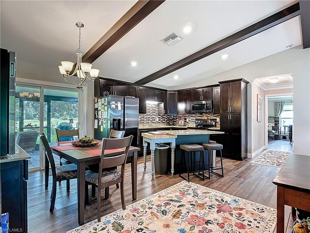 Chandelier, Dining room, Interior, Kitchen, Recessed Lighting, Stainless Steel Appliances, Wood Texture Flooring