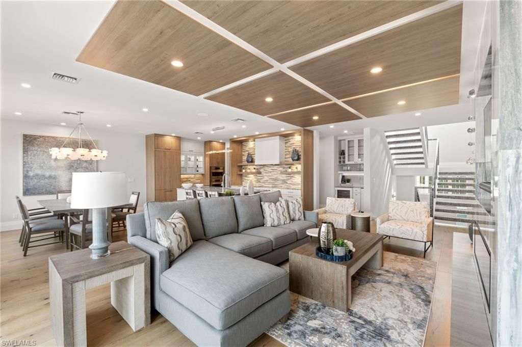 Chandelier, Dining room, Interior, Kitchen, Living room, Pendant Lights, Recessed Lighting, Stainless Steel Appliances, Stone Walls, Wooden Ceilings, Wood Texture Flooring