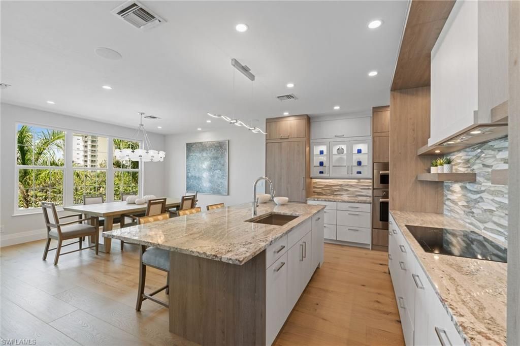 Dining room, Interior, Kitchen, Pendant Lights, Recessed Lighting, Stainless Steel Appliances, Wood Texture Flooring