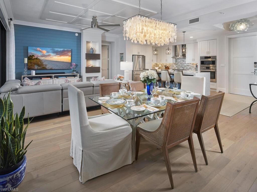 Chandelier, Dining room, Interior, Kitchen, Living room, Pendant Lights, Recessed Lighting, Stainless Steel Appliances, Wood Texture Flooring