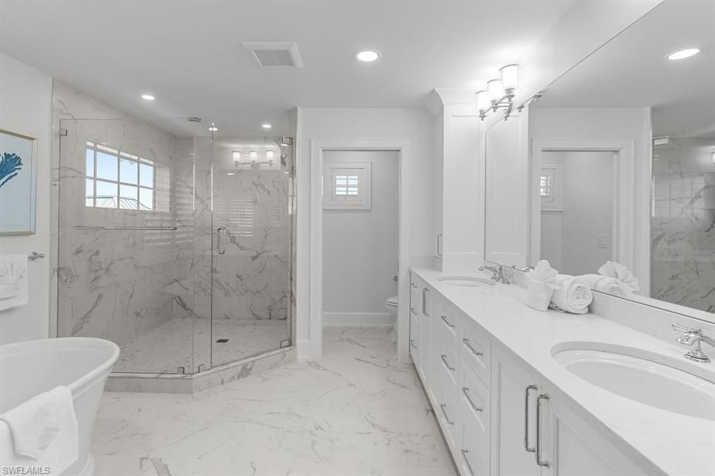 Bathroom, Dual Sink Vanities, Free Standing Baths, Glass Shower, Interior, Marble, Marble Walls, Recessed Lighting