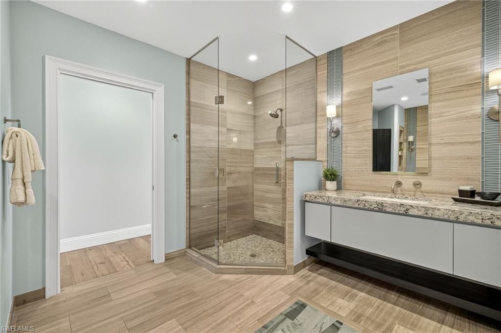 Bathroom, Dual Sink Vanities, Glass Shower, Interior, Recessed Lighting, Wood Texture Flooring