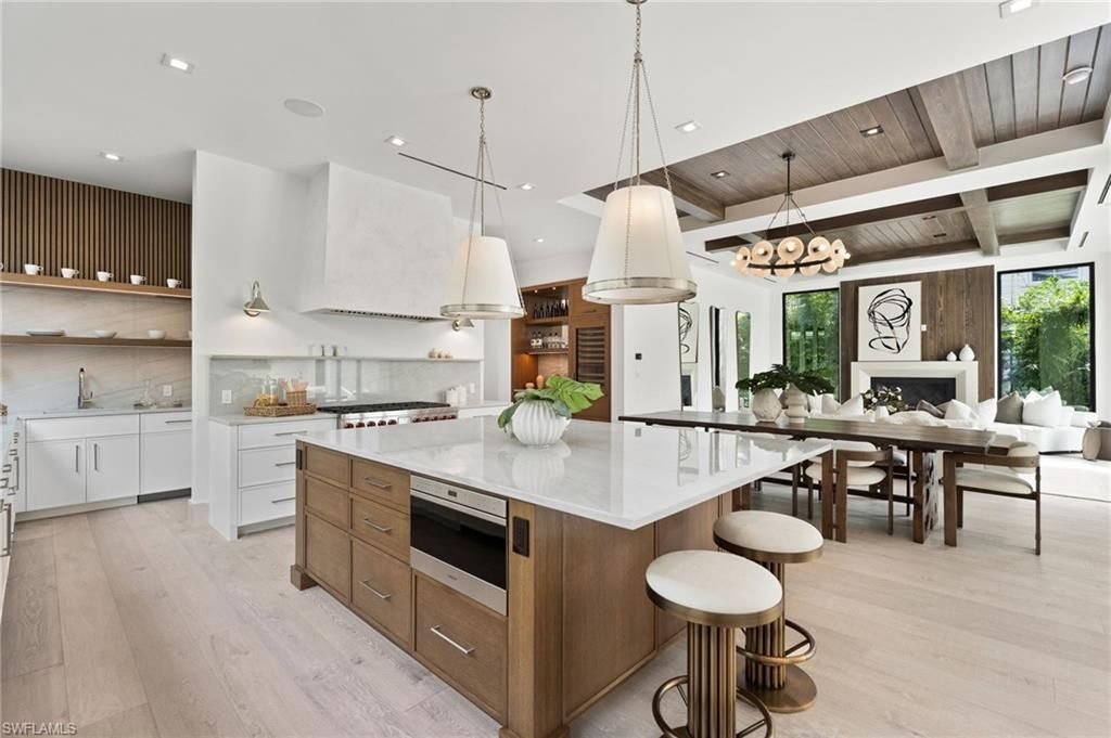 Chandelier, Dining room, Fireplace, Interior, Kitchen, Living room, Pendant Lights, Recessed Lighting, Stainless Steel Appliances, Wooden Beams, Wooden Ceilings, Wood Texture Flooring