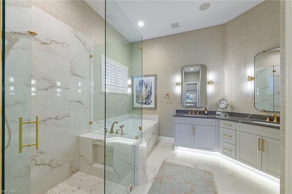 Bathroom, Dual Sink Vanities, Glass Shower, Interior, Marble, Marble Walls, Recessed Lighting