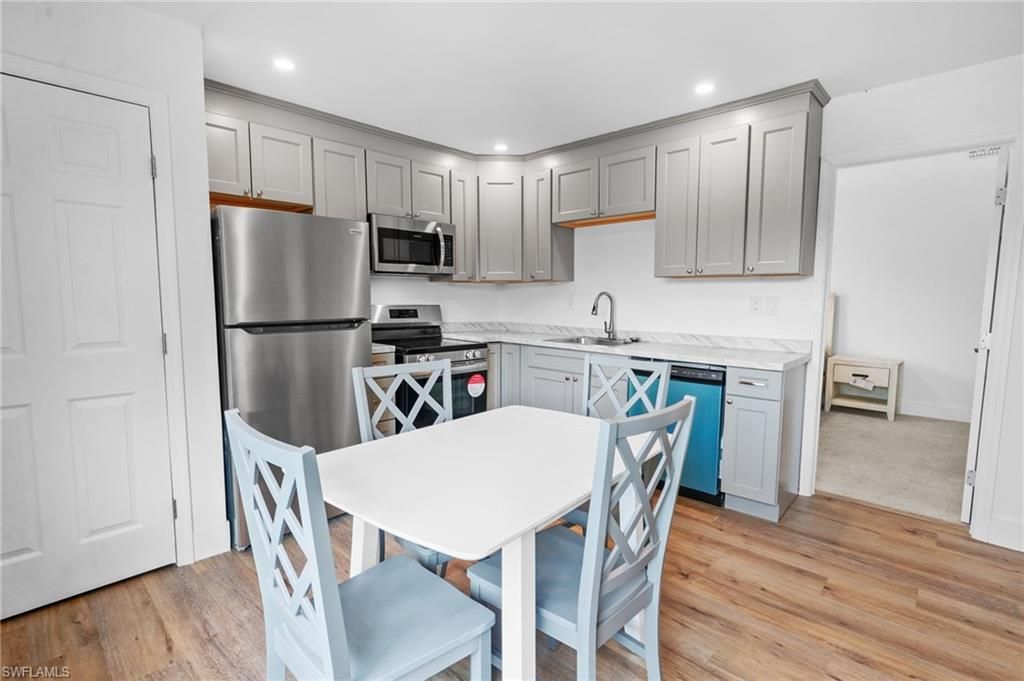 Dining room, Interior, Kitchen, Recessed Lighting, Stainless Steel Appliances, Wood Texture Flooring