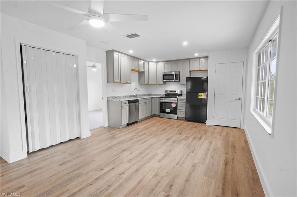 Interior, Kitchen, Recessed Lighting, Stainless Steel Appliances, Wood Texture Flooring