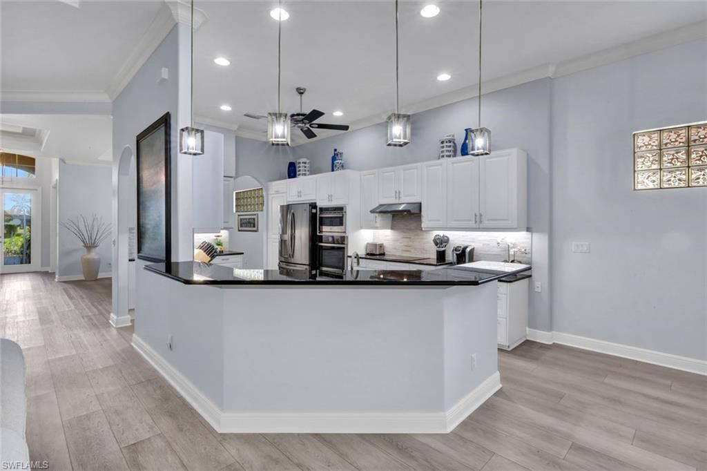 Interior, Kitchen, Pendant Lights, Recessed Lighting, Stainless Steel Appliances, Wood Texture Flooring