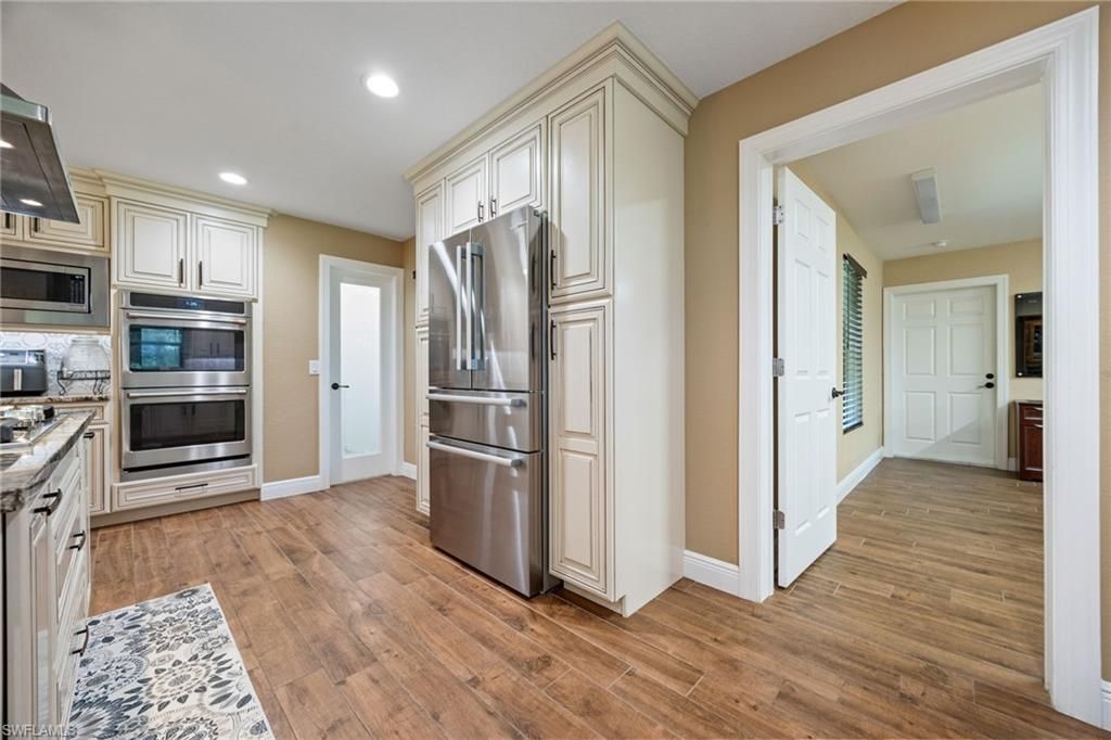 Interior, Kitchen, Recessed Lighting, Stainless Steel Appliances, Wood Texture Flooring