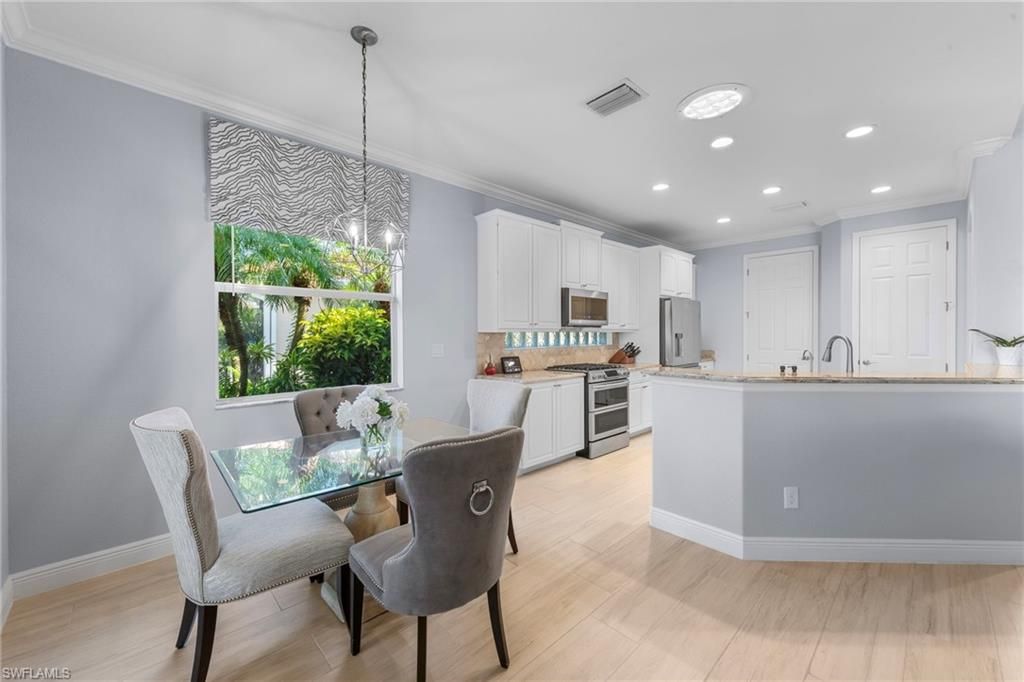 Dining room, Interior, Kitchen, Pendant Lights, Recessed Lighting, Stainless Steel Appliances, Wood Texture Flooring