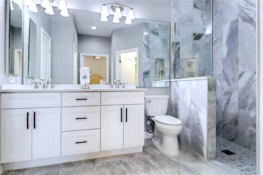 Bathroom, Dual Sink Vanities, Glass Shower, Interior, Marble Walls, Recessed Lighting