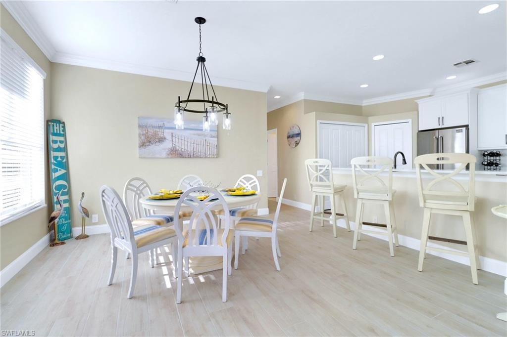Dining room, Interior, Kitchen, Pendant Lights, Recessed Lighting, Stainless Steel Appliances, Wood Texture Flooring