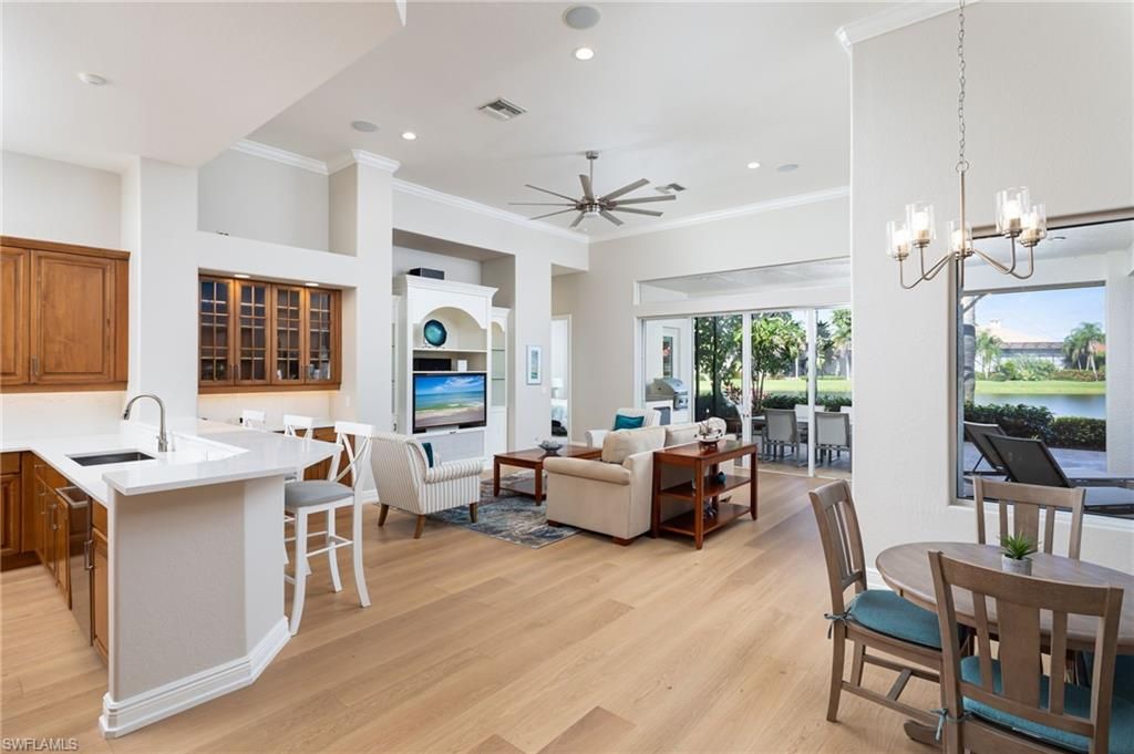 Chandelier, Dining room, Fireplace, Interior, Kitchen, Living room, Pendant Lights, Recessed Lighting, Water, Wood Texture Flooring
