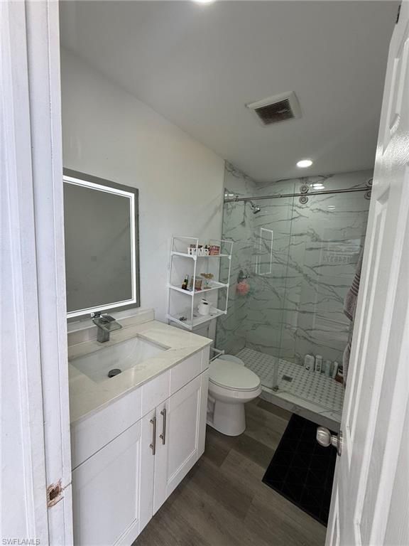 Bathroom, Glass Shower, Interior, Marble Walls, Recessed Lighting, Wood Texture Flooring