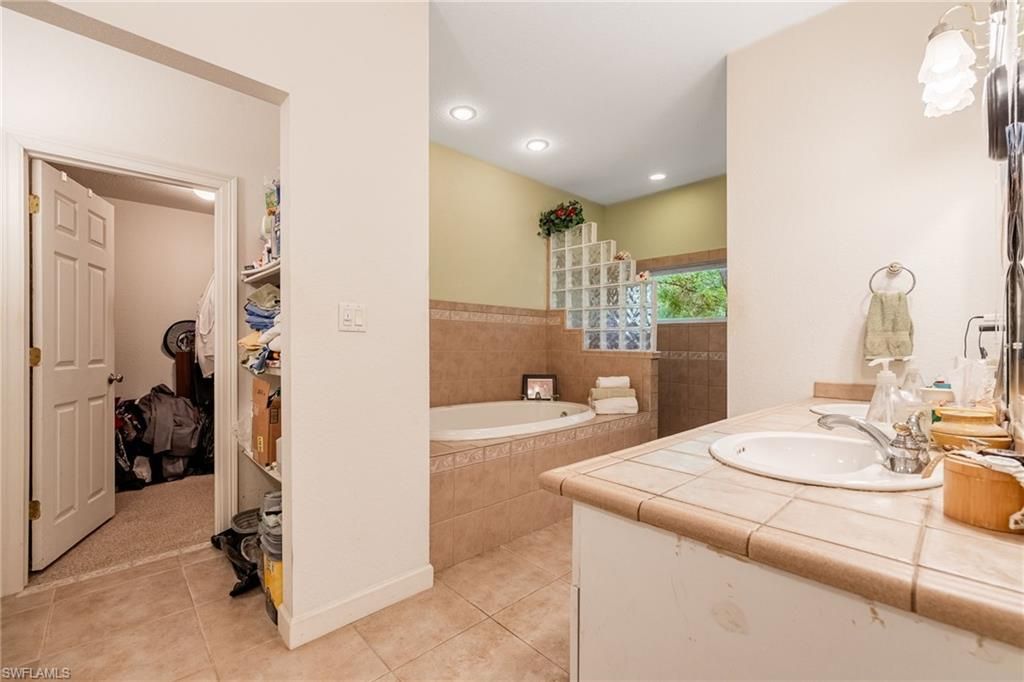 Bathroom, Dual Sink Vanities, Interior, Recessed Lighting, Tile Countertops