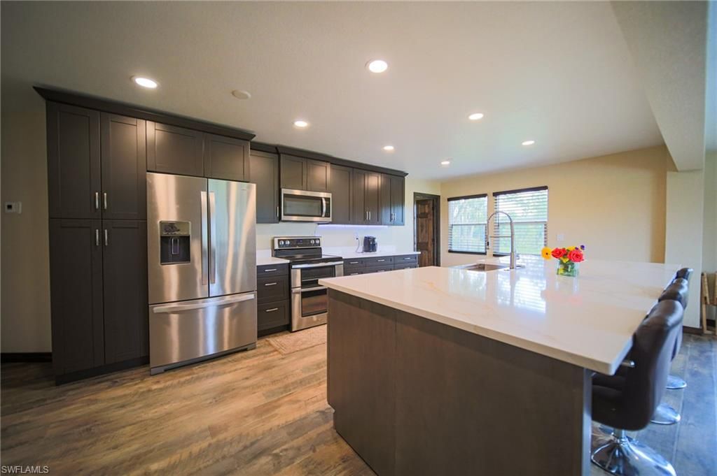 Interior, Kitchen, Recessed Lighting, Stainless Steel Appliances, Wood Texture Flooring