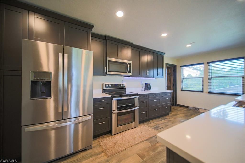 Interior, Kitchen, Recessed Lighting, Stainless Steel Appliances, Wood Texture Flooring