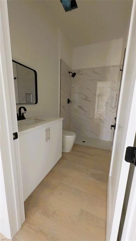 Bathroom, Dual Sink Vanities, Interior, Marble Walls, Wood Texture Flooring