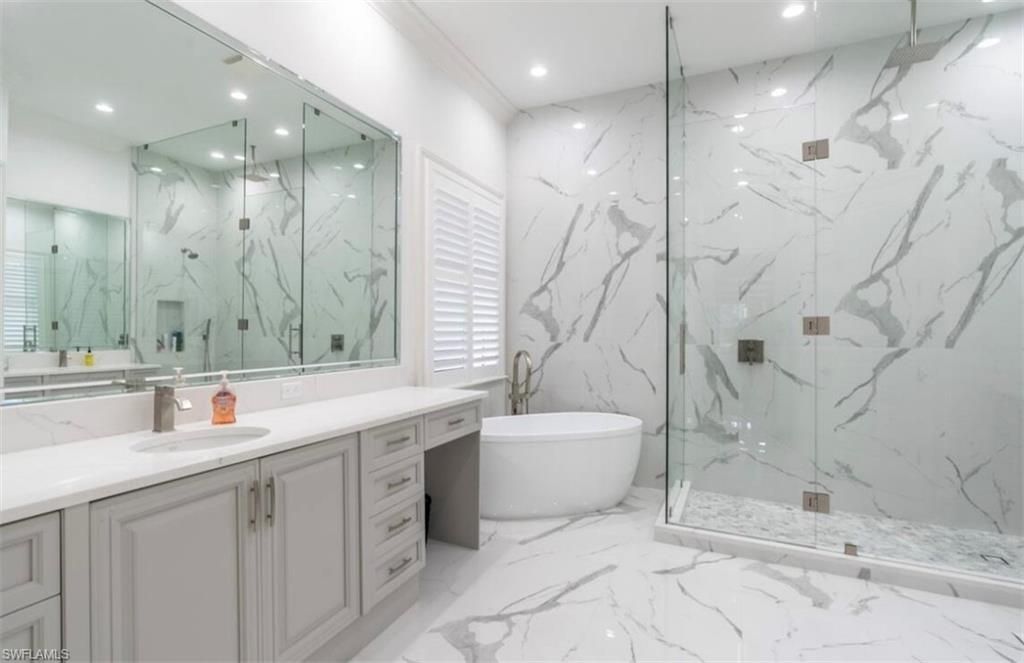 Bathroom, Dual Sink Vanities, Free Standing Baths, Glass Shower, Interior, Marble, Marble Walls, Recessed Lighting