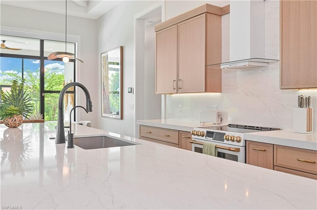 Interior, Kitchen, Marble Walls, Pendant Lights, Recessed Lighting, Stainless Steel Appliances