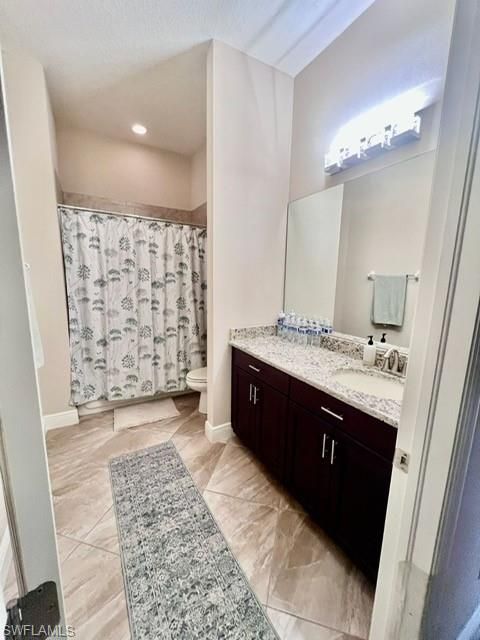 Bathroom, Dual Sink Vanities, Interior, Recessed Lighting, Wood Texture Flooring