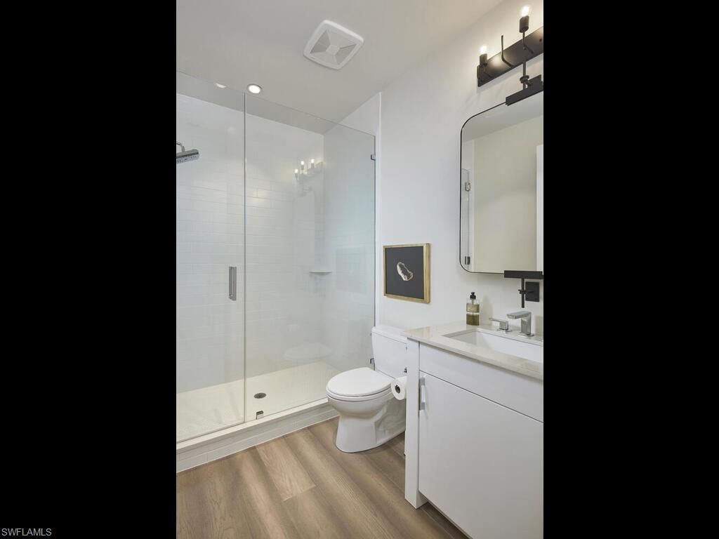 Bathroom, Glass Shower, Interior, Recessed Lighting, Wood Texture Flooring
