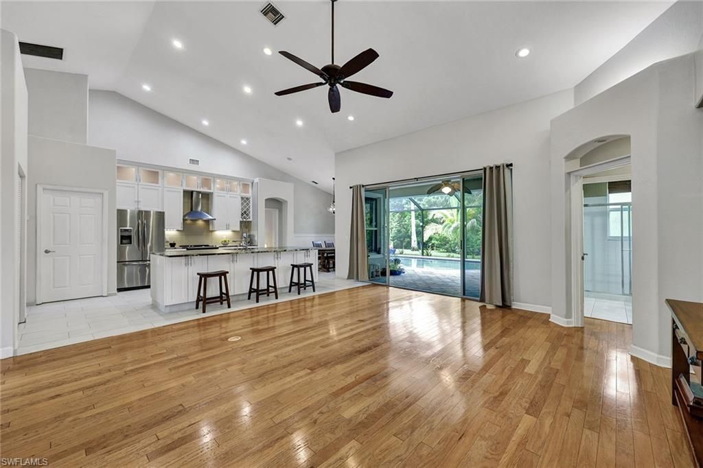 Empty room, Interior, Kitchen, Recessed Lighting, Stainless Steel Appliances, Wood Texture Flooring