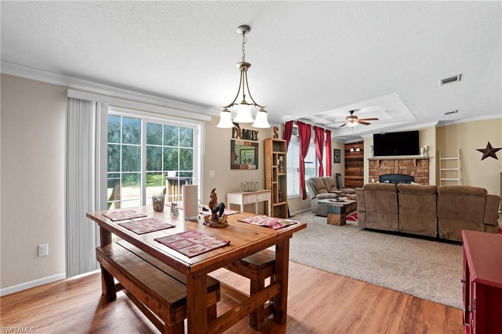 Chandelier, Dining room, Fireplace, Interior, Living room, Wood Texture Flooring