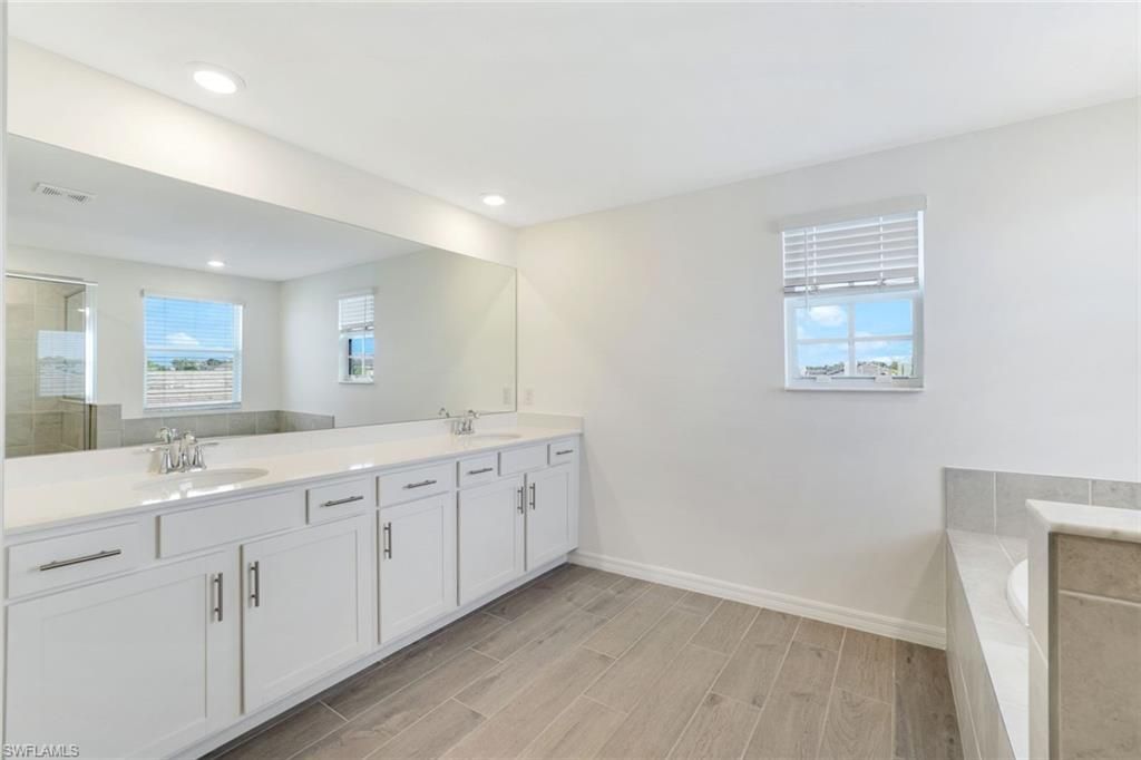 Bathroom, Dual Sink Vanities, Interior, Recessed Lighting, Wood Texture Flooring