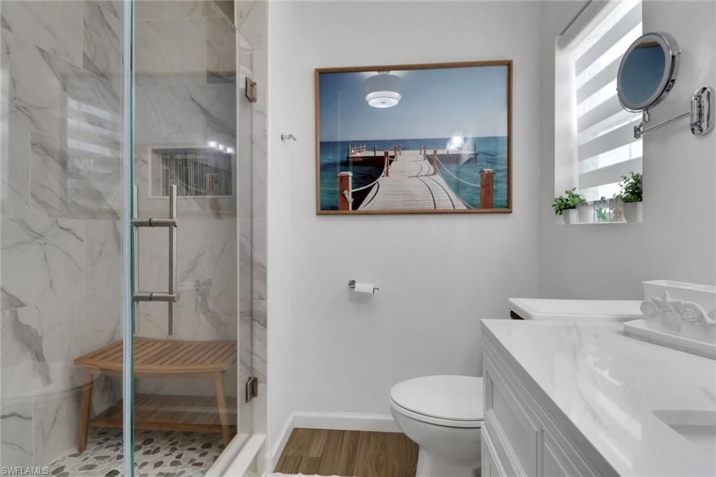 Bathroom, Glass Shower, Interior, Marble Walls, Wood Texture Flooring