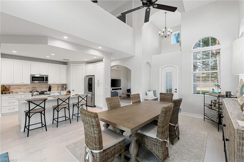 Chandelier, Dining room, Interior, Kitchen, Pendant Lights, Recessed Lighting, Stainless Steel Appliances, Wood Texture Flooring
