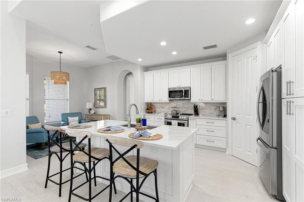 Chandelier, Interior, Kitchen, Pendant Lights, Recessed Lighting, Stainless Steel Appliances, Wood Texture Flooring