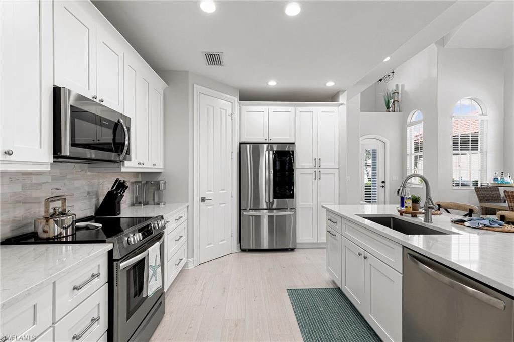 Interior, Kitchen, Recessed Lighting, Stainless Steel Appliances, Wood Texture Flooring