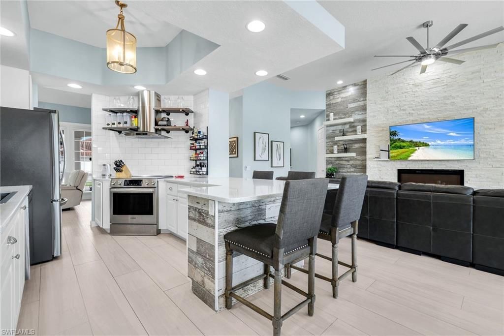 Interior, Kitchen, Pendant Lights, Recessed Lighting, Stainless Steel Appliances, Stone Walls, Wood Texture Flooring