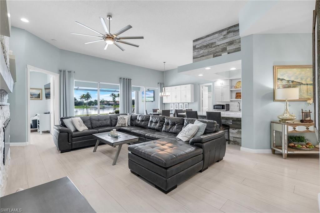 Fireplace, Interior, Kitchen, Living room, Pendant Lights, Recessed Lighting, Stainless Steel Appliances, Wood Texture Flooring