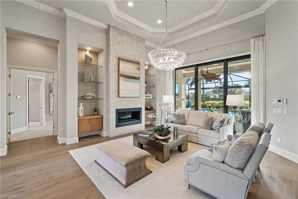 Chandelier, Fireplace, Interior, Living room, Pendant Lights, Recessed Lighting, Wood Texture Flooring